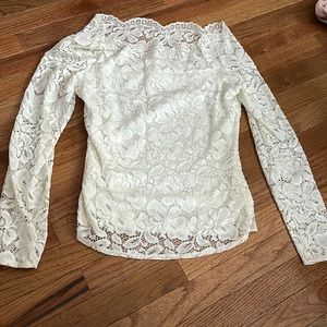 I’m a selling a white, floral/lace long sleeve.